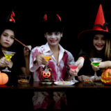 Group young asian in costume celebrate halloween party on black wall with concept for halloween fashion festival gang of teen